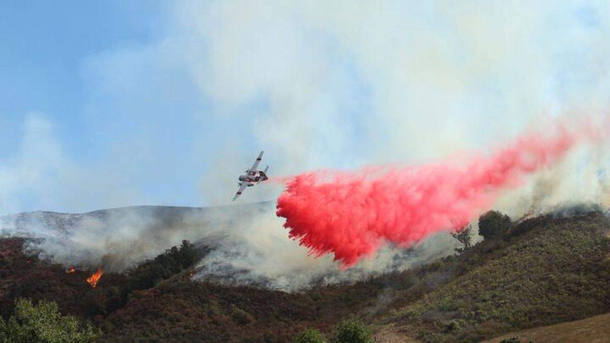 An air tanker drops fire retardant