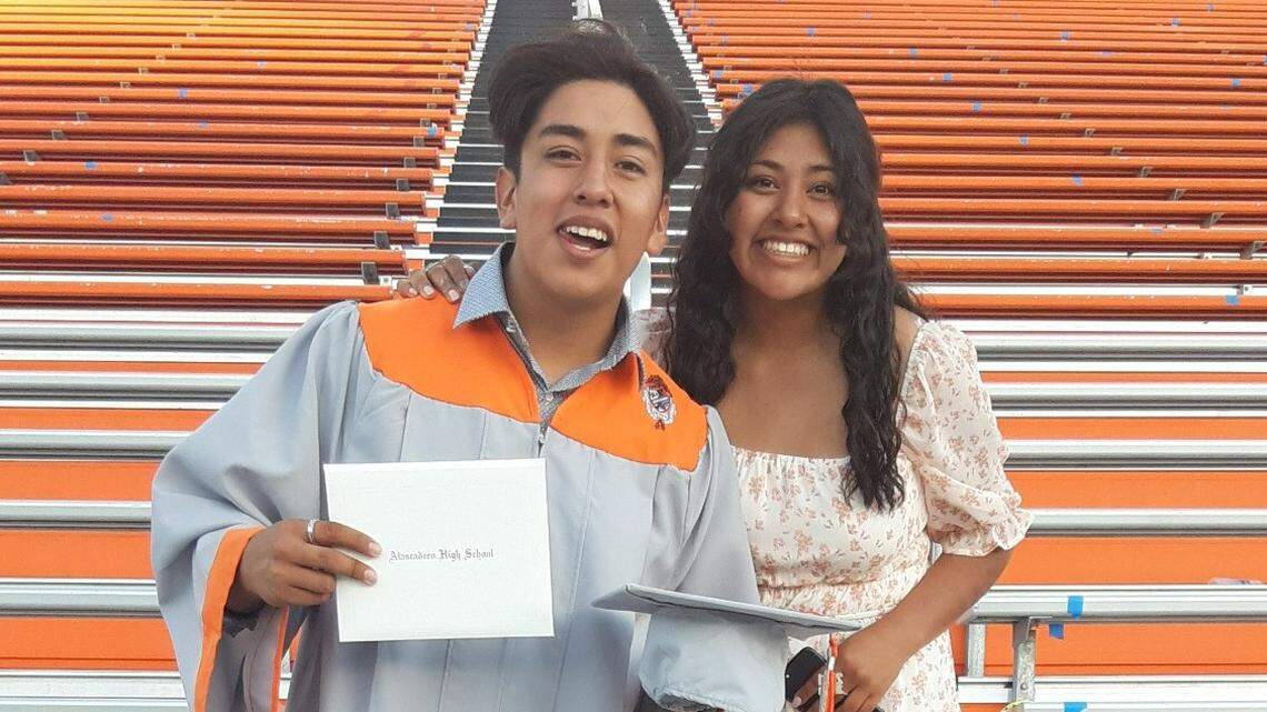 Jimmy Claudio poses with his diploma from Atascadero High School next to his sister, Priscilla Amador. After struggling through distance learning, he worked hard to finish the year strong and graduated in June.