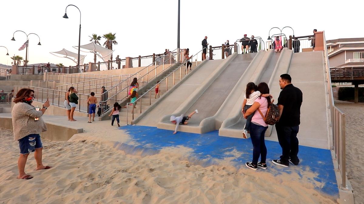 A child tumbles off one of the new slides at Pismo Beach’s Pier Plaza in September 2020. The slide has recently been the subject of lawsuits.