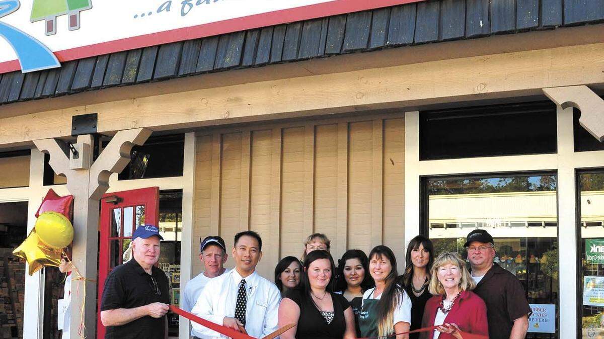 The Cambria Chamber of Commerce held a ribbon cutting Oct. 15, 2013, to celebrate new owner Alvin Ferrer's purchase of Cambria Drug & Gift nearly a year prior from John Headding. Marking the moment above from left in front are chamber board member Michael Thompson, Ferrer, pharmacy employees Brittany Searle and Lindsay Flammer, and chamber Executive Director Mary Ann Carson. In back are chamber board member Steve Kniffen, pharmacy employees Brianna Podrasky, Teri Wittenberg, Margarita Alfaro and Christie Montoya, and chamber board member George Marschall board member.