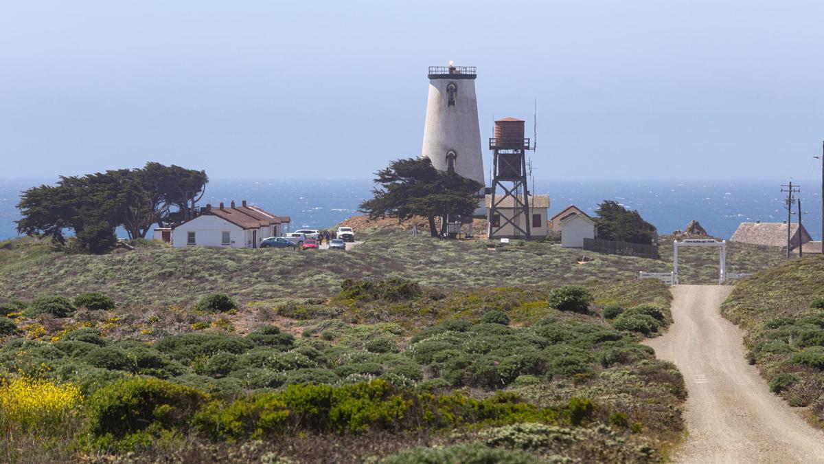 The Piedras Blancas Light Station near San Simeon. The circa-1874 First Order Fresnel lighthouse lens that, for decades, beamed warnings to sailors from atop the tower, is on display in Cambria, housed in an aging glass enclosure. The future of the lens is being discussed, and agencies involved want community members to weigh in on the decision.