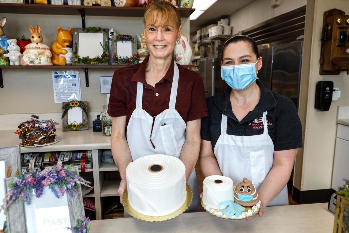 Arroyo Grande Bakery owner Chris Lossing, left, and cake decorator Casey Davis, right, created toilet paper-shaped cakes, cupcakes and other treats to give something for people to laugh about.