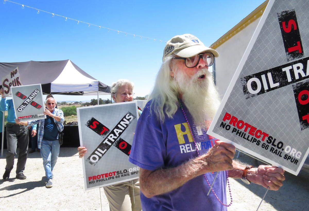 At his 90th birthday party in 2015, environmental activist Bill Denneen ended the event by leading attendees in a protest march against the proposed Phillips 66 oil train rail spur.