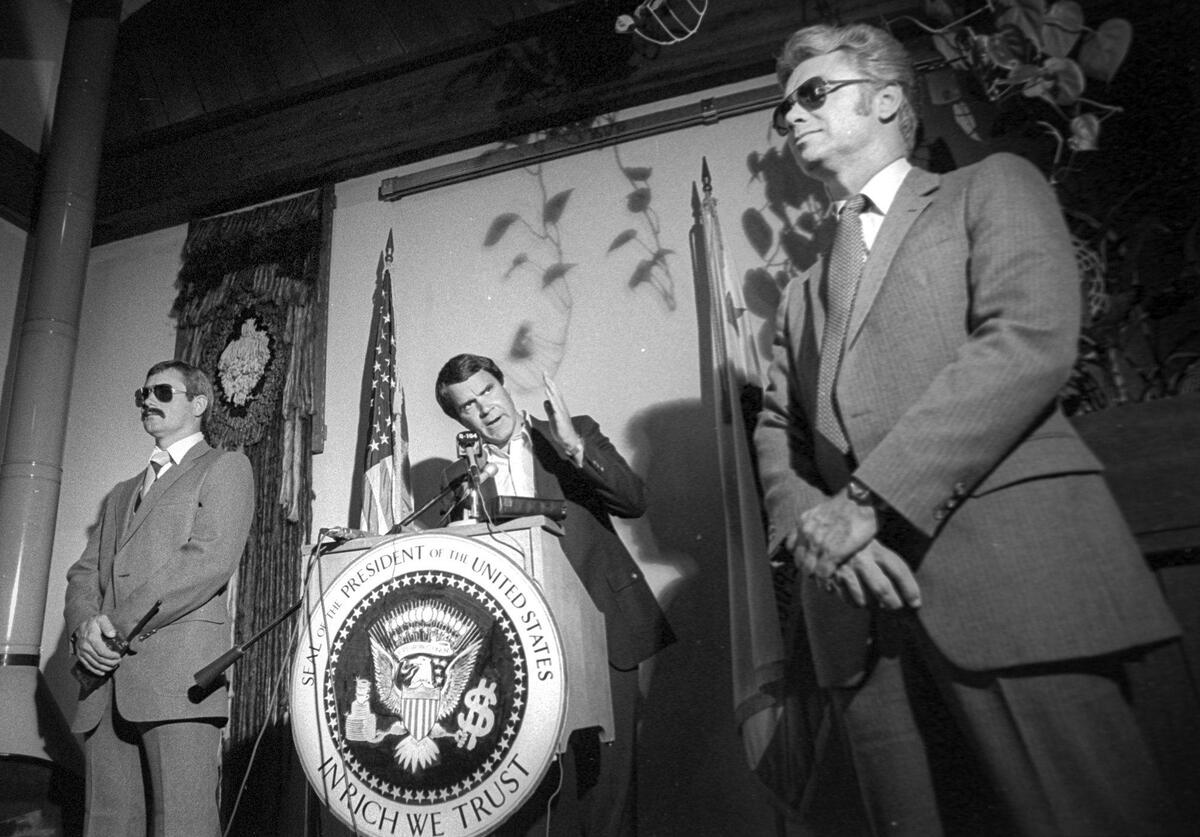 Comic impressionist Rich Little came to San Luis Obispo’s 1865 restaurant to promote an upcoming show at the California Mid-State Fair in Paso Robles. He was surrounded by actors playing Secret Service agents The preview was held on July 26, 1982.