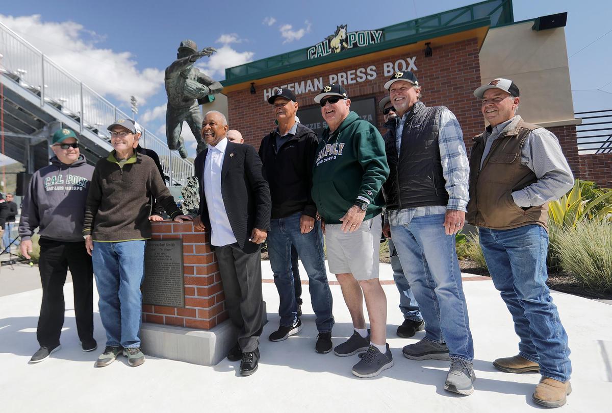 Ozzie Smith poses with some of his Cal Poly teammates at the re-dedication of his statue and plaza at Baggett Stadium in San Luis Obispo on March 25, 2023.