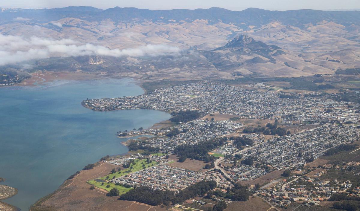 Los Osos crowds up against the Morro Bay Estuary with Hollister Peak in background. The Northern Chumash Tribal Council organized an aerial tour of lands bordering the Chumash Heritage National Marine Sanctuary on Sept. 18, 2024. The flight was sponsored by EcoFlight, a nonprofit dedicated to appreciation of the environment.