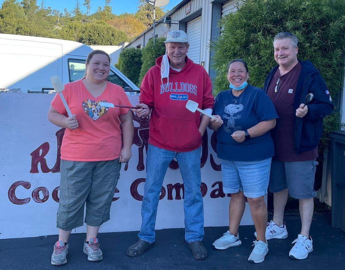 Three Nichol family members are the new owners of Cambria’s Red Moose Cookie Company, as of Nov. 13. From left in front of the industrial-park bakery and retail outlet are, from left, Tyler Nichol, former owner Roger Wall, Monica and George Nichol.