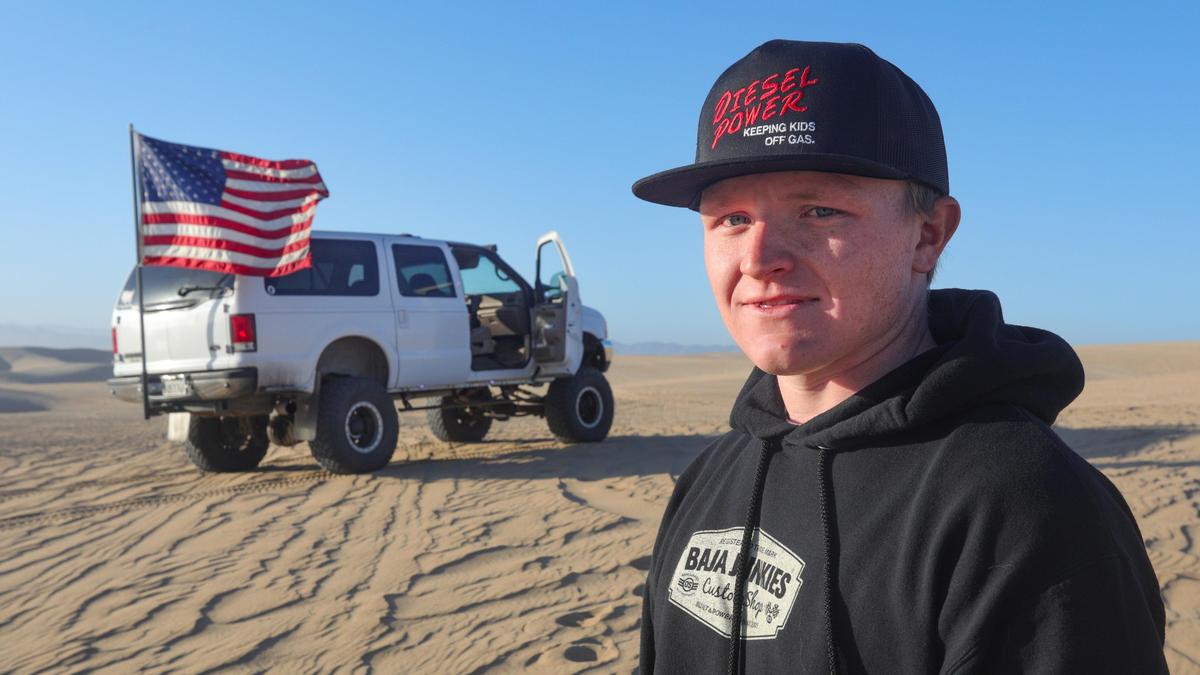 Austin Gladden, 19, poses for a picture at the Oceano Dunes State Vehicular Recration Area near Pismo Beach. After being in a traumatic, fatal off-roading accident at the state park when he was 6, he rides there as a form of therapy and enjoyment.