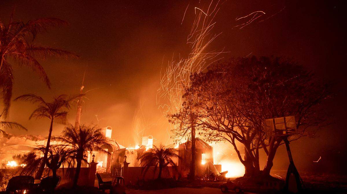 Flames consume a home on N. Fairview Ave. as the Holiday Fire burns in Goleta, Calif., on Saturday, July 7, 2018. The blaze has destroyed multiple homes. (AP Photo/Noah Berger)