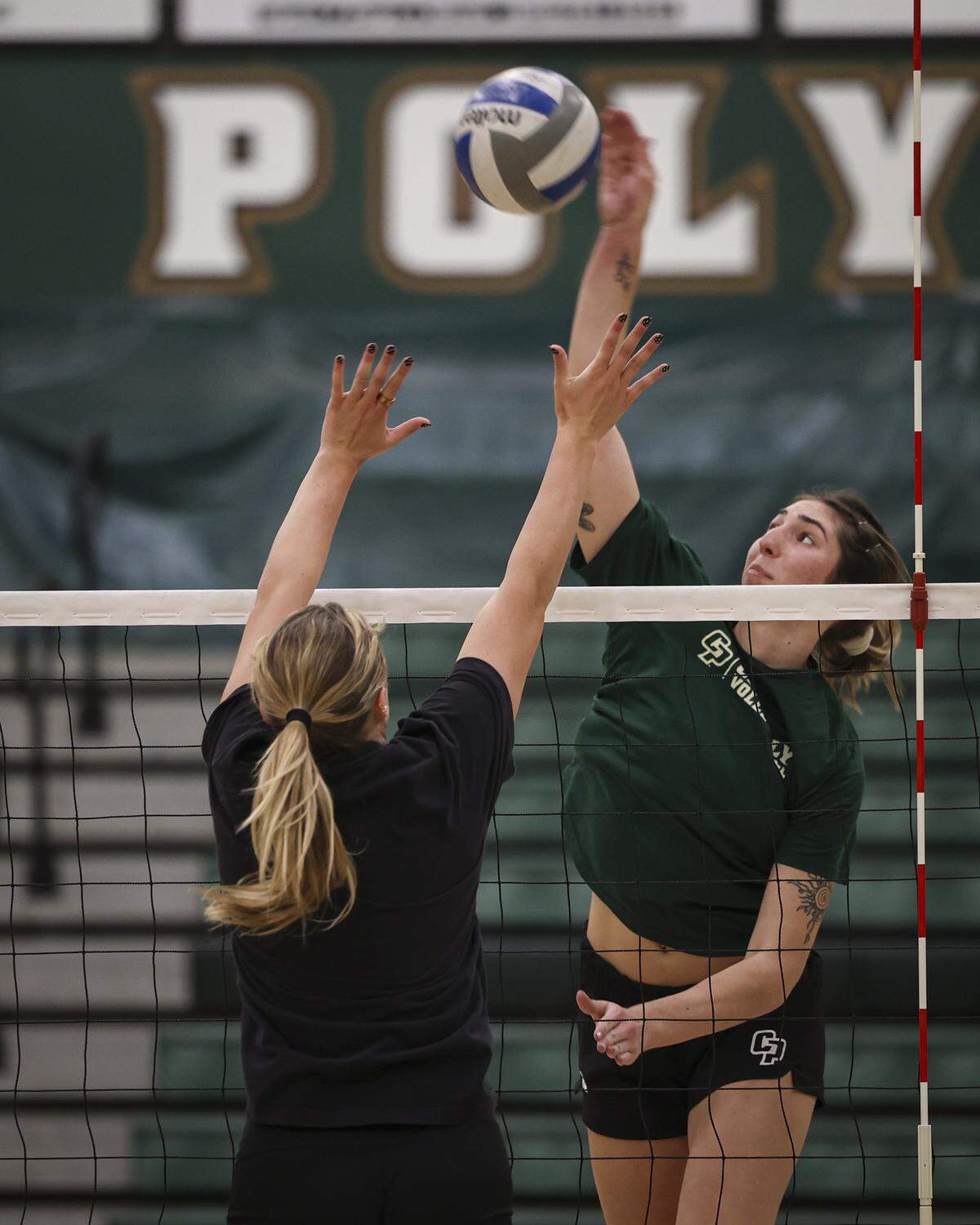 Annabelle Thalken hits during a Cal Poly women's volleyball practice on Dec. 8, 2025.