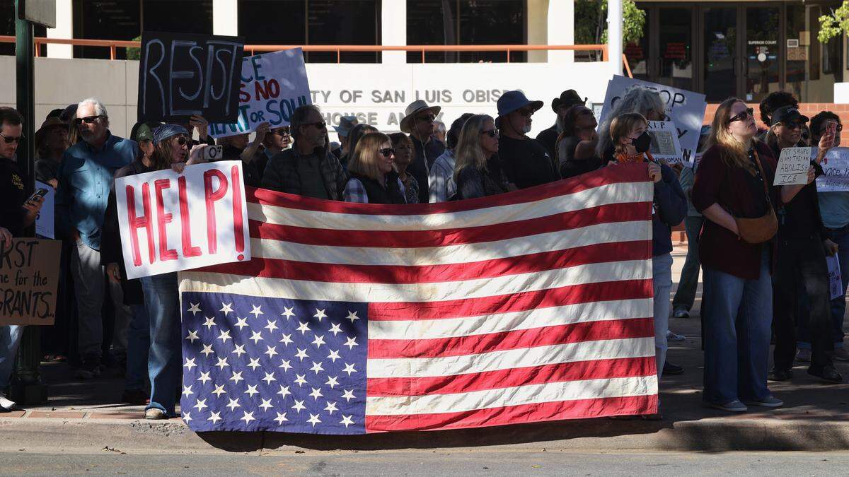 Protesters gather outside the San Luis Obispo County Board of Supervisors TRUTH Act forum on Jan. 27, 2026, where the Sheriff’s Office shared information about its cooperation with ICE.