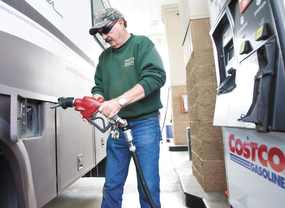 Bruce Snider of Paso Robes takes advantage of sub-$3 gas prices at Costco on Wednesday.