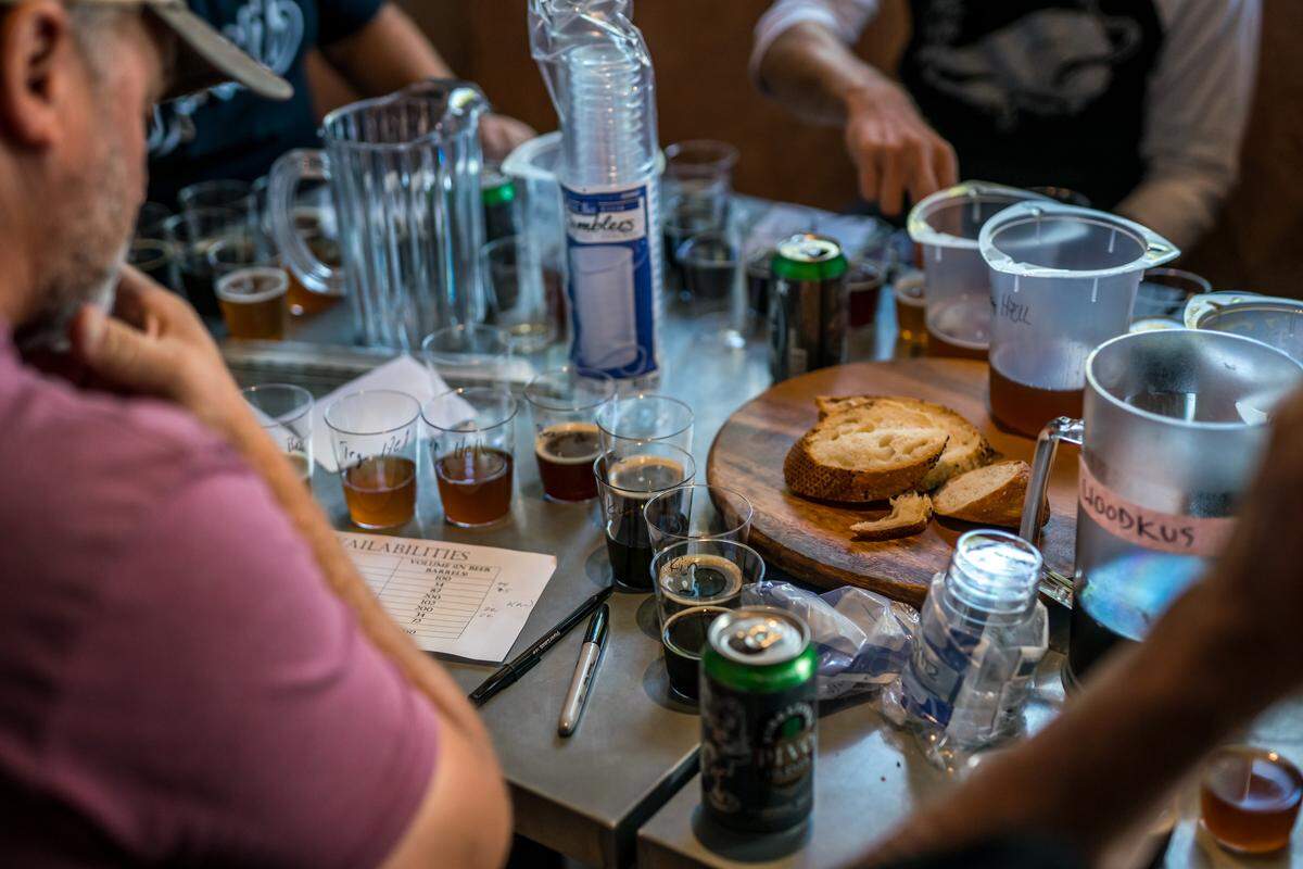 Participants in a blending competition at Firestone Walker Brewing Co. in Paso Robles sample from eight barrel-aged beers.