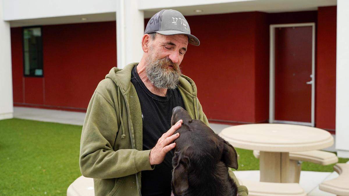 U.S. Marine Corps veteran Brian Brewer was homeless for 12 years in San Luis Obispo County, and now lives at Broad Street Place with his dog, Admiral, and daughter, Kimie, in an affordable housing complex by People’s Self-Help Housing, pictured March 1, 2024. .