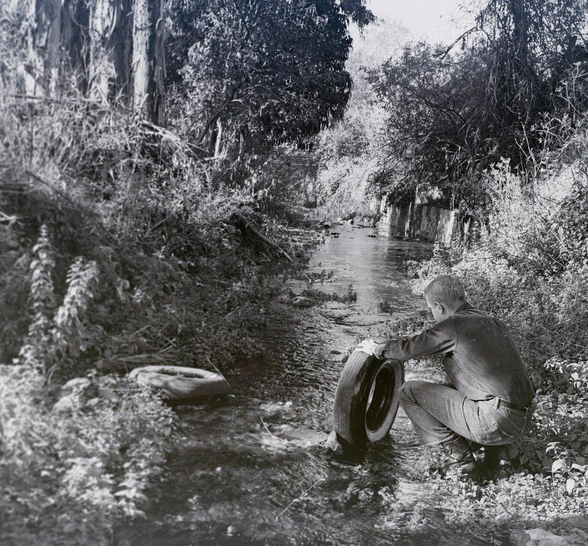 San Luis Obispo Creek’s beauty is frequently marred due to its use by some people as a dumping ground for old tires and other discards. Reporter Gil Bailey and photographer John Dreyfuss took a walk down a junk filled San Luis Obispo creek before Mission Plaza was built for a story published Dec. 28, 1963.