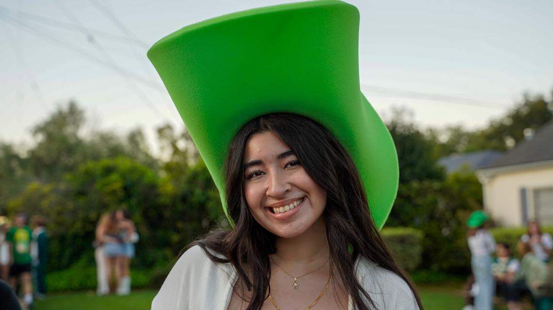 Cal Poly student Lily Martinez poses for a picture in an oversize green cowboy hat during St. Fratty’s Day festivities on March 16, 2024. A San Luis Obispo Police Department officer at the scene of the party estimated between 6,000 and 7,000 people in attendance.