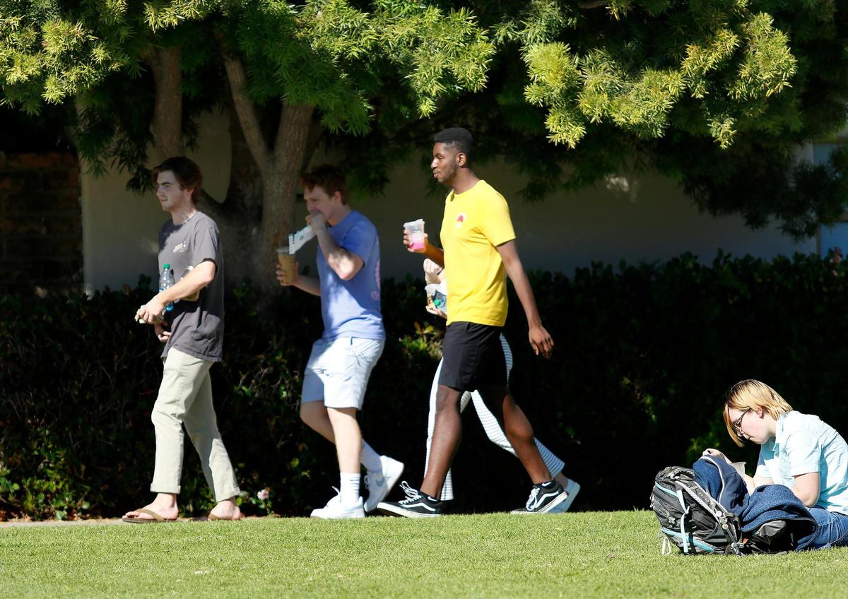 Students walk to and from classes at Cal Poly on a January afternoon.
