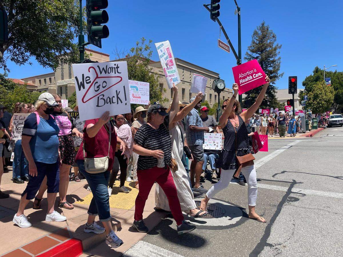 People march at a Planned Parenthood rally in downtown San Luis Obispo on Saturday, May 14, 2022.