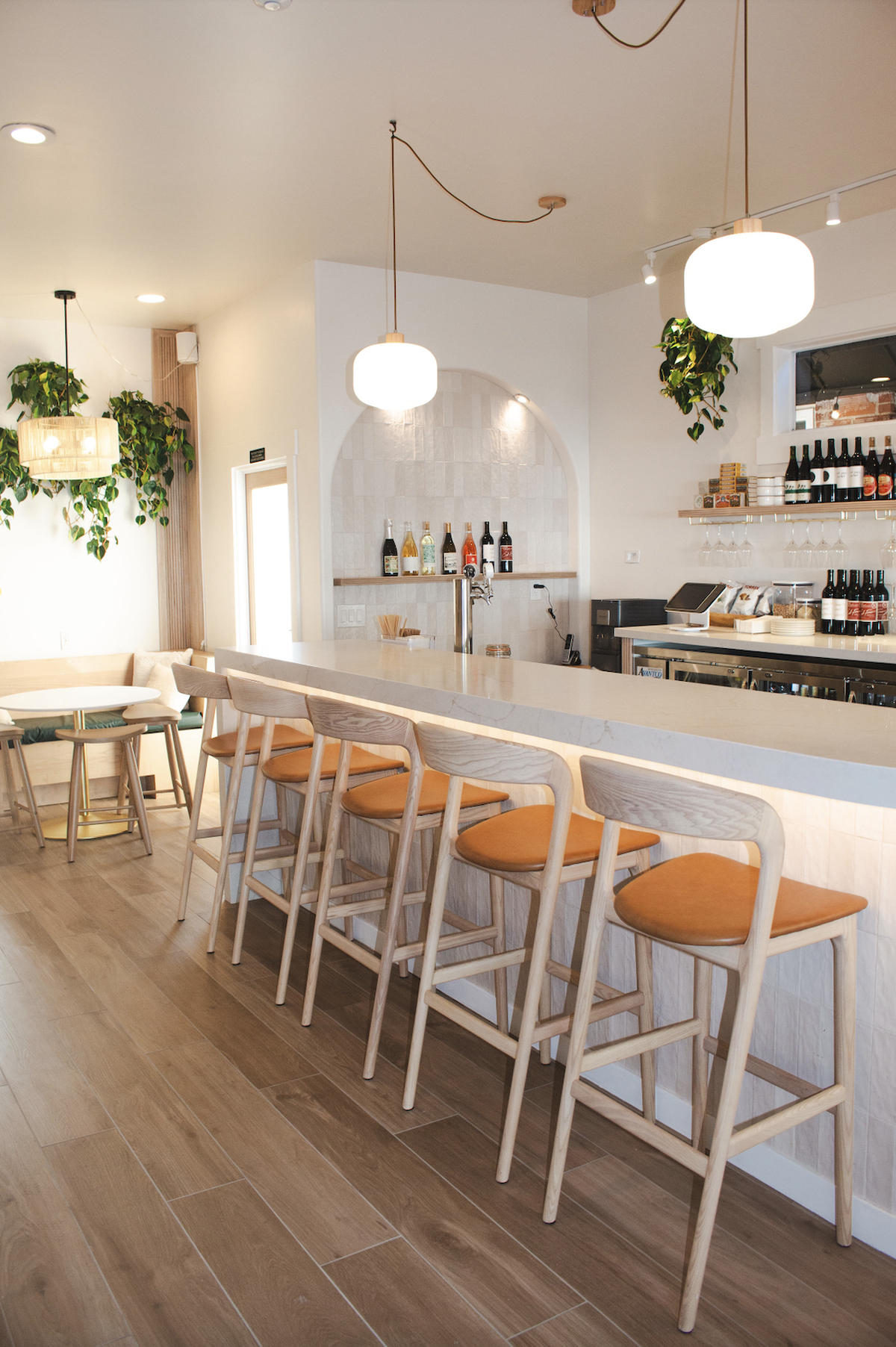 Brix Wine Bar and Bottle Shop has tables and a bar counter.