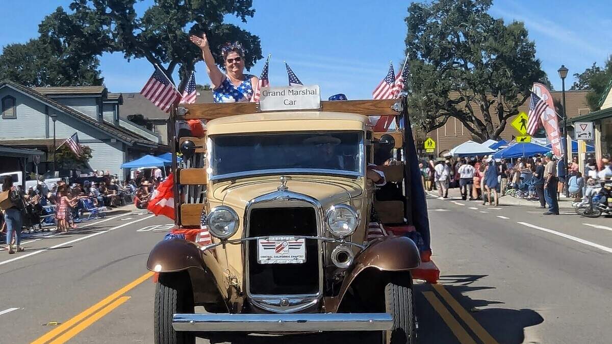 Grand Marshal Vicki Akin Zimmerman waved to spectators while leading Templeton’s annual Fourth of July Parade on Saturday, July 4, 2026.