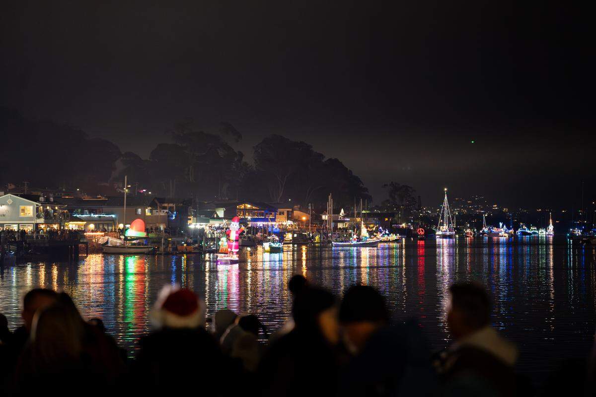 Boats line up for the Morro Bay Lighted Boat Parade on Saturday, Dec. 13, 2025. The parade drew thousands of onlookers and dozens of boats equipped with festive lighting.