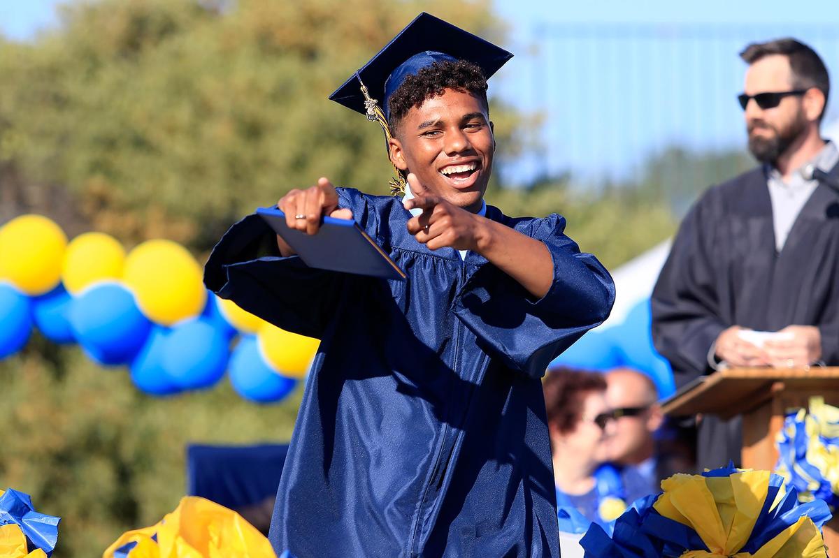 Jason Castro accepts his diploma during the Arroyo Grande High School graduation ceremony on Thursday.