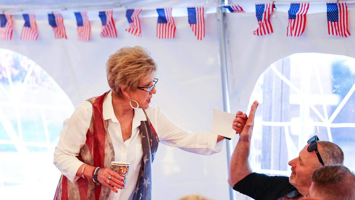 Stacy Korsgaden gives a fist bump to Jeff Madden at an election night on June 7, 2022. Korsgaden is running for mayor of Grover Beach.
