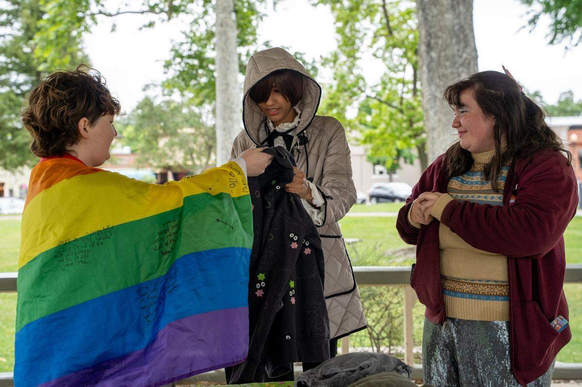 Paso Robles High School Queer Student Union members hold a clothing swap event at Downtown City Park in Paso Robles on Saturday, May 2, 2026. The Queer Student Union offers community to LGBTQ+ students through after-school events such as a clothing swap held in the park.