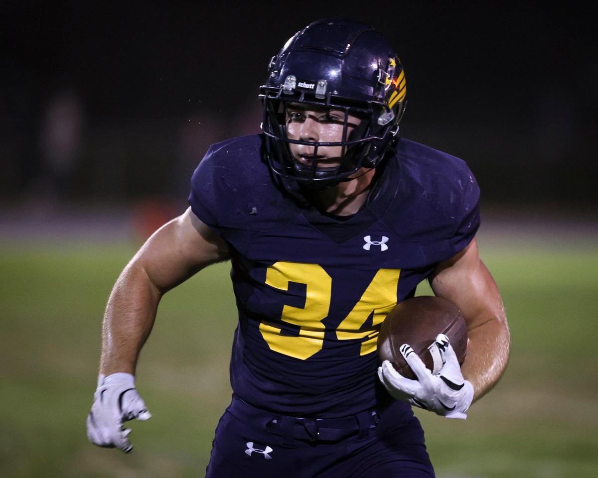 Zack Tayman carries the ball for Arroyo Grande, which beat St. Joseph 21-6 in a high school football game on Oct. 18, 2024.
