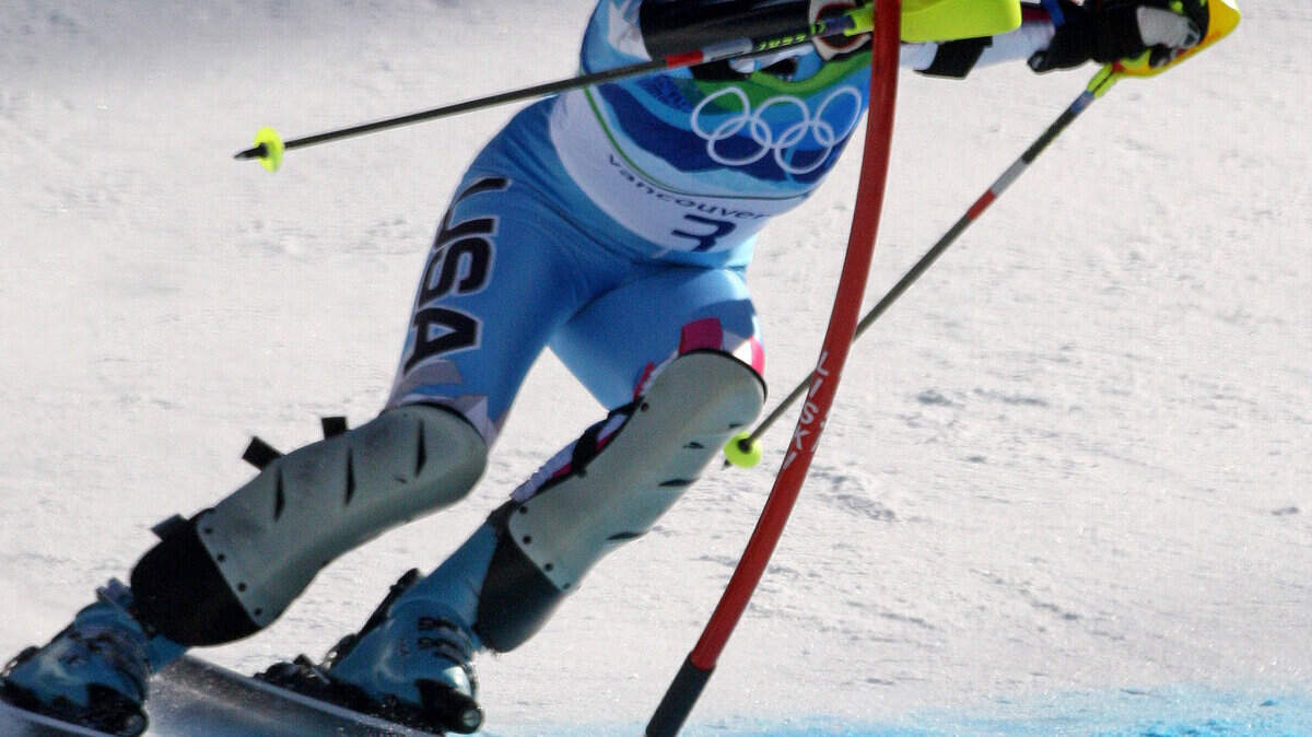 Julia Mancuso of the United States hits the last slalom gate before crossing the finish in the super combined. (Steve Ringman / Seattle Times / MCT)