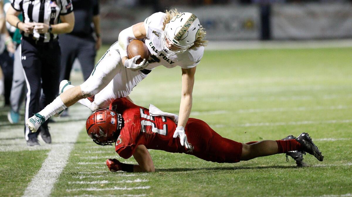 Cal Poly hosted Eastern Washington at Alex G. Spanos Stadium, Saturday, Nov. 16, 2019, in the last home game of the season. Cal Poly’s Xavier Moore (3) makes a catch, but gets tackled by Eastern Washington’s Calin Criner (25) during a first half play.