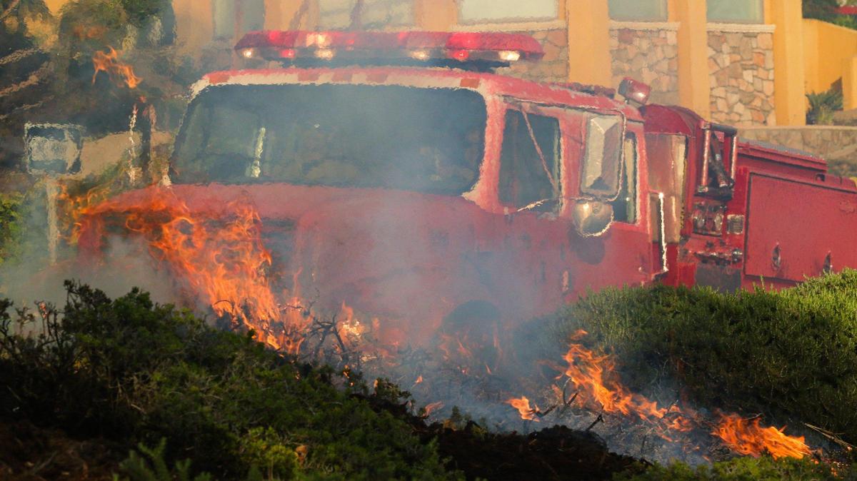 An engine from Atascadero was one of several hit by fire retardant as they protected structures. A wind driven brush fire quickly moved south along Highway 101 along the Shell Beach straits and into Pismo Beach.