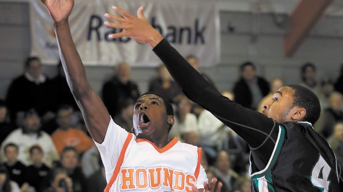 Atascadero High guard Troy Norris (23) goes to the basket against Inglewood’s Joseff Singleton during a CIF-Southern Section Division 4AA playoff game last season.