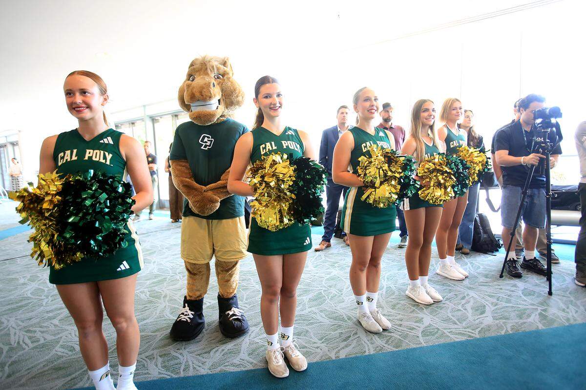 The Cal Poly cheerleader team, along with the mascot Musty, attended the announcement on Sept. 25, 2025, that Carter Henderson, a deputy athletics director at Stanford, has been picked to succeed Don Oberhelman as Cal Poly’s new athletic director.