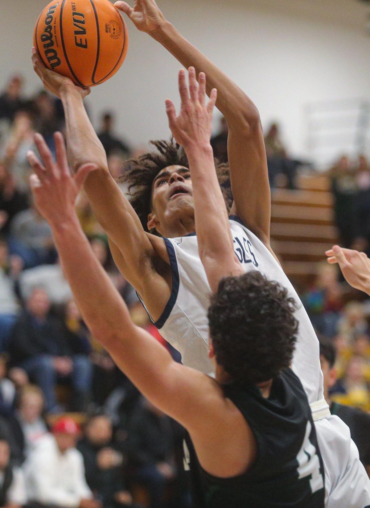 Noah Morris puts up a shot under the basket in Arroyo Grande’s 60-40 win over Dinuba in the Division 2 Central Section semifinals for boys basketball on Feb. 22, 2023.