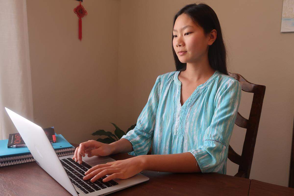Emily Pan, 15, sits at her computer working on classwork. She and Talia Zundel are students at San Luis Obispo High School and have created the website Eating Local on the Central Coast to raise awareness of local farms and encourage people to eat healthy.