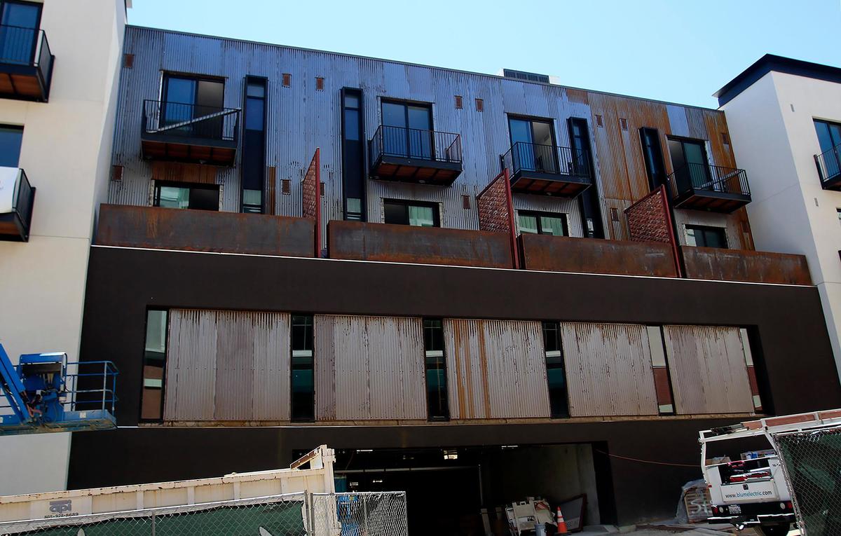Siding that resembles rusty, corrugated metal has been used extensively on the exterior of Hotel San Obispo. It’s expected to weather to a more uniform bronze color.