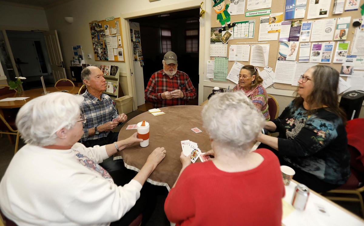 Members of the San Luis Obispo Senior Center took a break from their card game to discuss their take on the coronavirus pandemic, Friday, March 13, 2020.