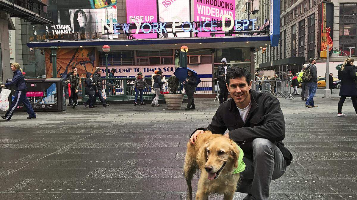 Evan Ball of Atascadero with his dog, Fritz, in Times Square.