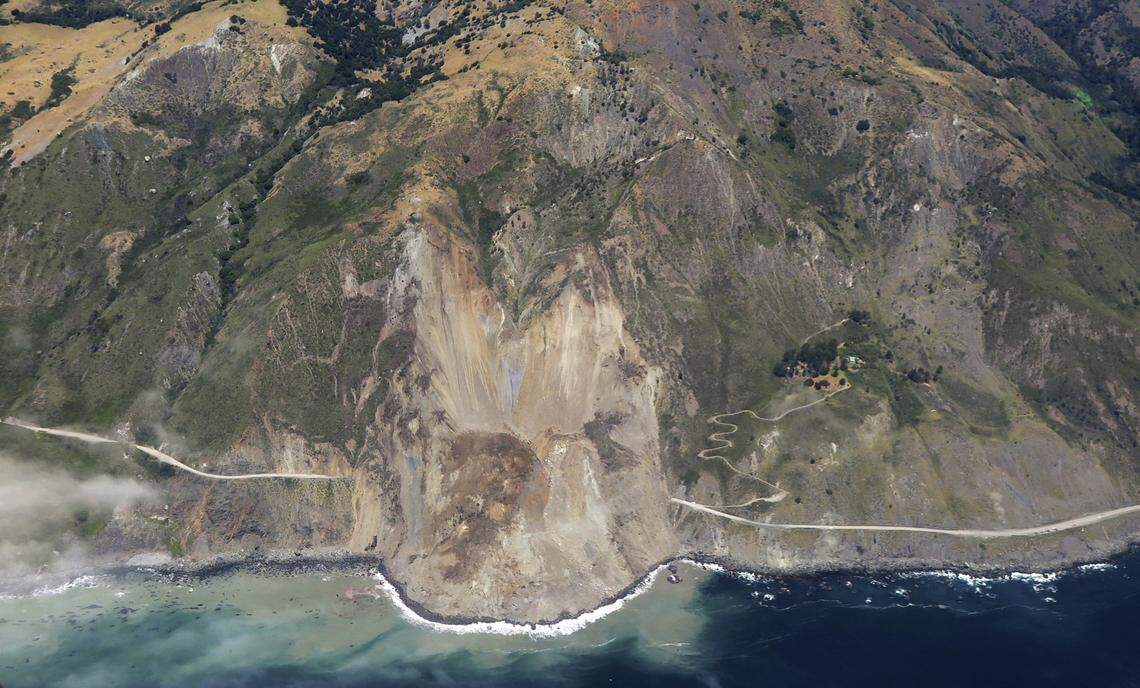 This May 22, 2017 aerial file photo shows the massive landslide along California's coastal Highway 1 that has buried the road under a 40-foot layer of rock and dirt near Big Sur, California.