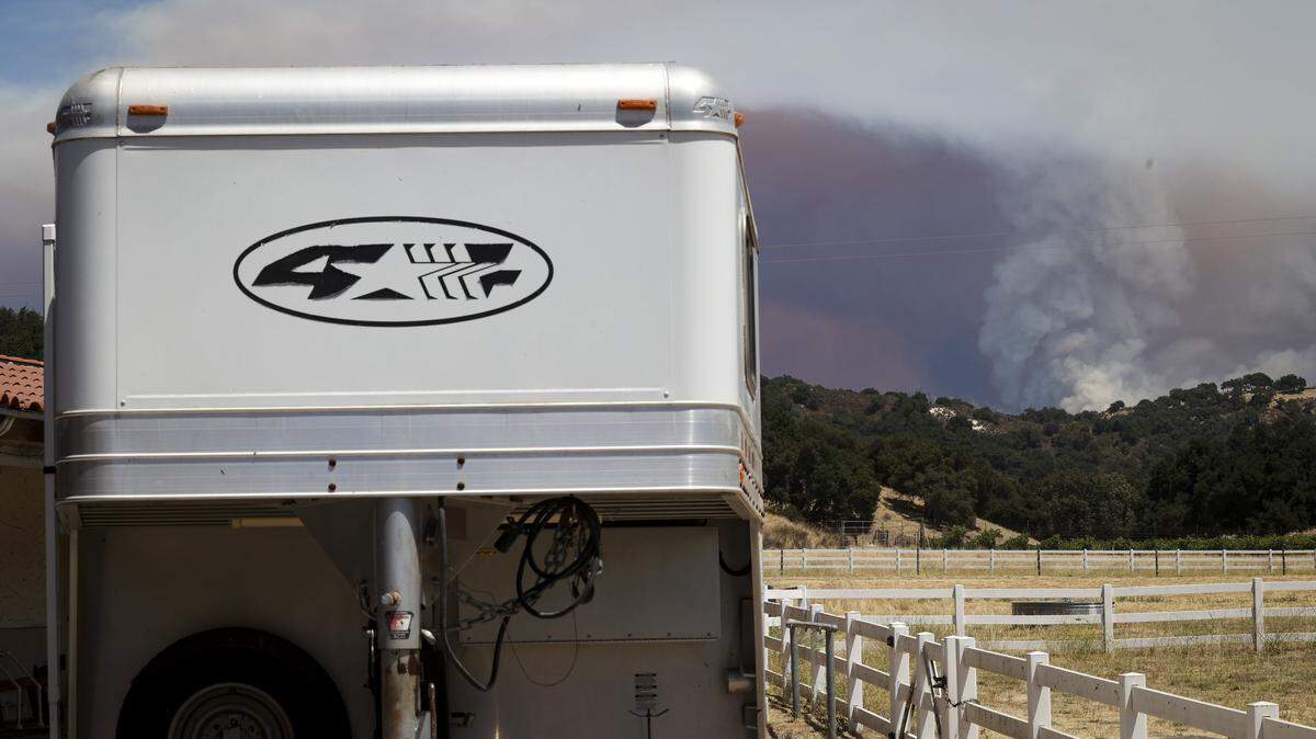 Smoke rises from the Gifford Fire burning from the Los Padres National Forest toward an area under an evacuation order behind Lopez Lake, seen here from Hi Mountain Road on Aug. 7, 2025.