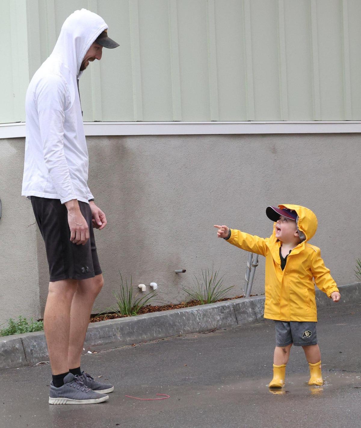 Bryan New helps son Bennett, 2, learn the joy of puddle splashing in San Luis Obispo on Monday, Sept. 19, 2022., as he invites his dad to jump in too. An early-season rainstorm dropped as much as 1.5 inches of rain in parts of San Luis Obispo County.