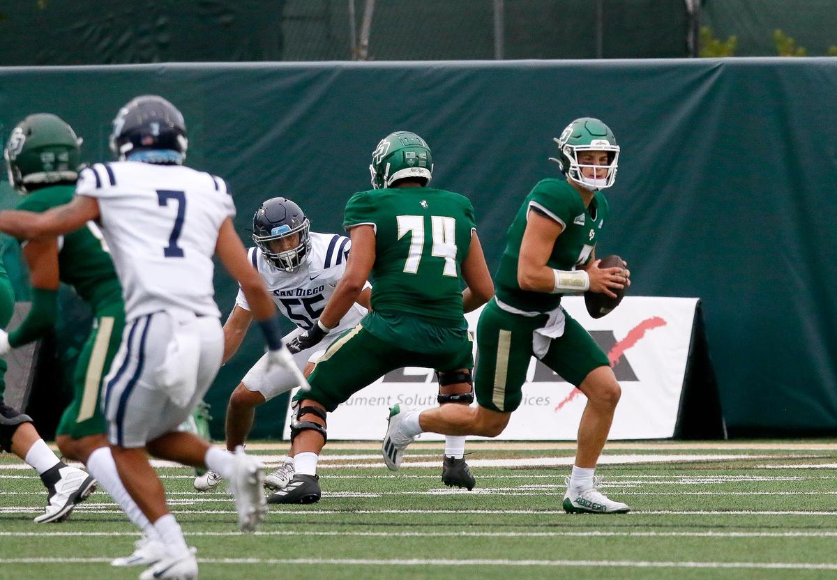 Mustang quarterback looks to pass. Cal Poly SLO football beats University of San Diego 27-10 in season opener at Cal Poly University’s Mustang Memorial Field in San Luis Obispo, Saturday, September 2, 2023.