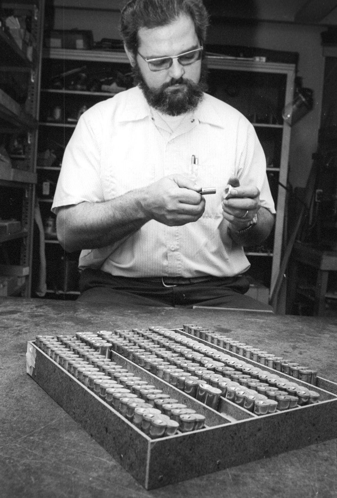 Gene Nowicki replaces lock core, selecting from hundreds in shop at Cal Poly on Nov. 17, 1978.