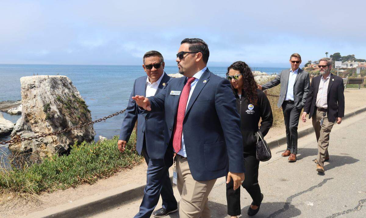 Congressman Salud Carbajal, left, visited the eroding bluffs near Dinosaur Caves Park with Pismo Beach City Manager Jorge Garcia, right, on Thursday, Aug. 8, 2024. The Bipartisan Infrastructure Law will provide $200,000 in funding to prevent ocean bluff erosion at Dinosaur Caves Park in Pismo Beach. The $3.1 million project with replace all of the storm drain infrastructure and add a secure wall to protect the street and ocean bedrock.