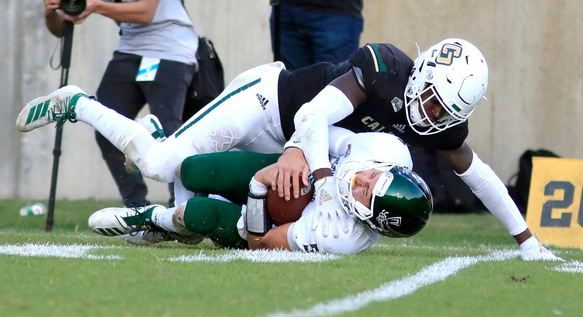 Cal Poly hosts Sacramento State in a Big Sky Conference game at Alex G. Spanos stadium, Saturday, October 26, 2019. Cal Poly’s Kitu Humphrey (8) stop Sac State quarterback Kevin Thomson (5).