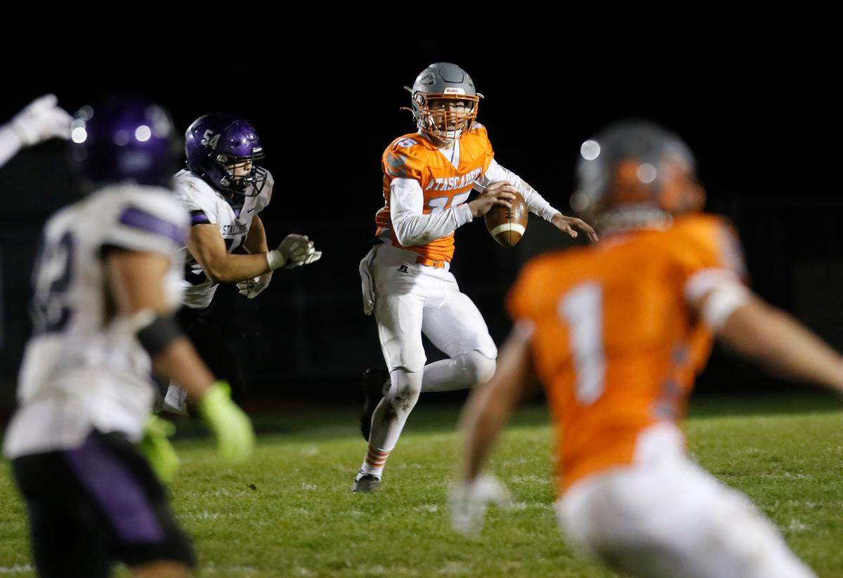 Greyhound Kane Cooks (15) look around to pass. Atascadero beat Madera South 39-8 in the second round of the CIF Central Section Division 5 football playoffs on Nov. 10, 2022.
