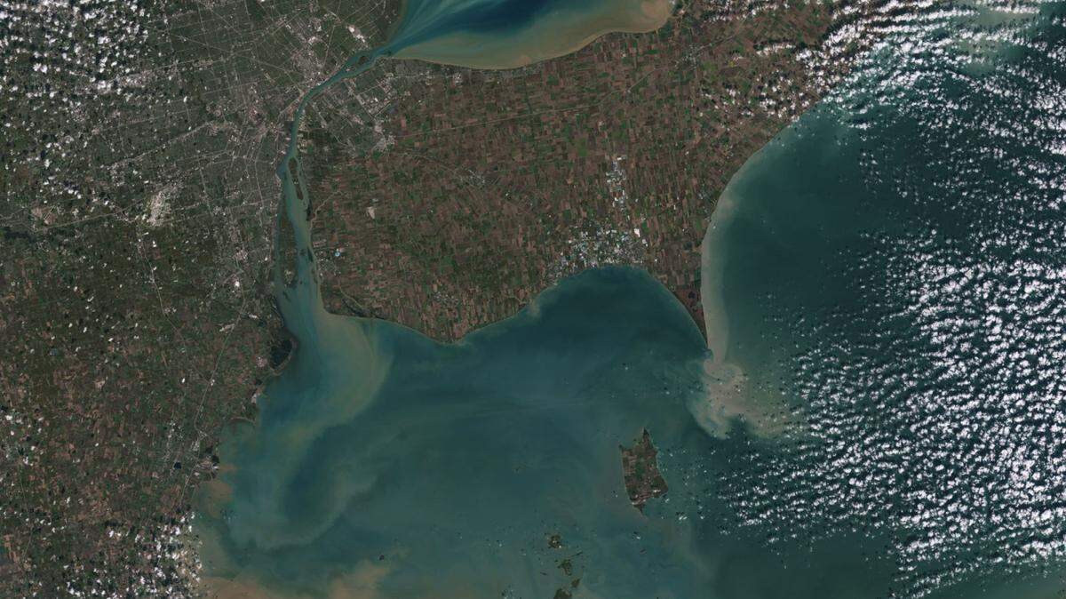 Sediments swirl in Lake Erie and Lake St. Clair in a Landsat 9 image of Detroit, Michigan, and Windsor, Ontario, from Oct. 31. The Great Lakes serve as sources of fresh water, recreational activity, transport and habitat for the upper-Midwestern United States, and water quality remains a high priority.