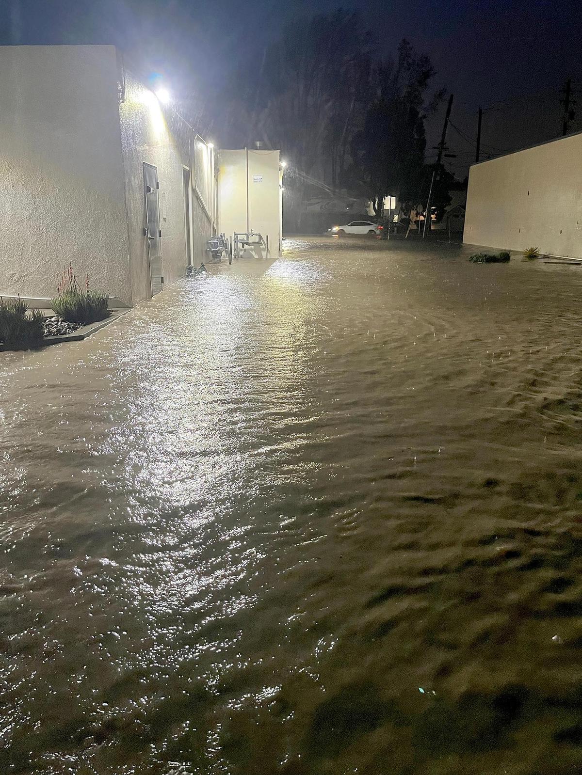 Photo showing flooding behind the Nautical Bean coffee shop on Parker Street in San Luis Obispo. Brett Jones, owner of Nautical Bean, said, “He’s never seen this before. I didn’t expect this (flooding)!” (Photo Courtesy of Brett Jones)