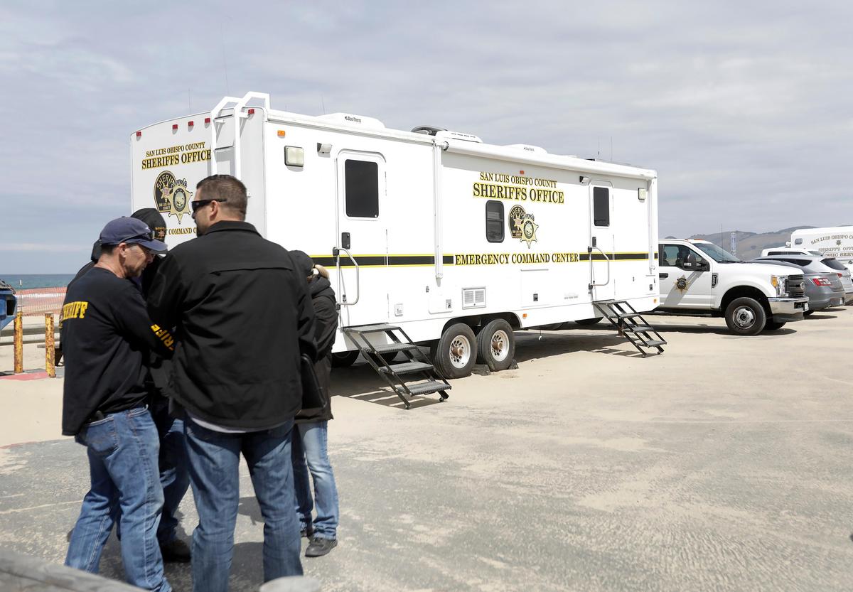 A shooting occurred at Oceano Dunes SVRA early Sunday morning, May 5, 2019. SLO Sheriff deputies and investigators confer near the SLO Sheriff command center trailer in the parking lot at the Pier Avenue entrance to the beach. (Photo by Laura Dickinson)